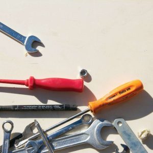 red and silver hand tool